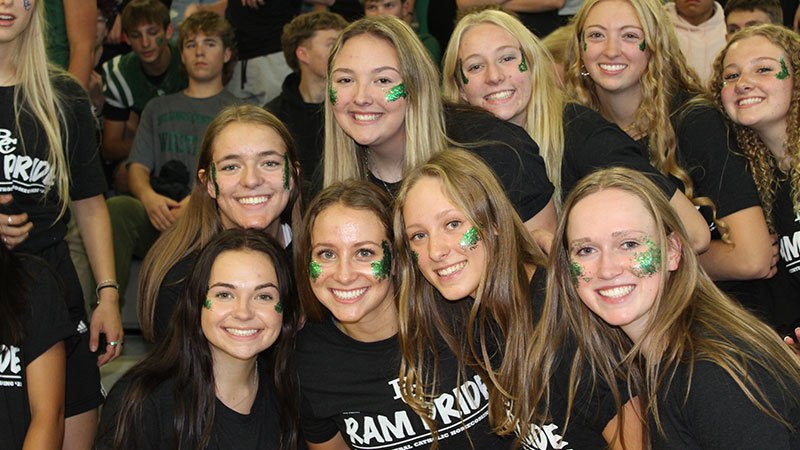 Young women at school game showing off school spirit